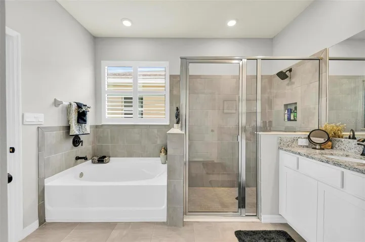 Luxurious garden tub, perfect for unwinding after a long day and indulging in some well-deserved relaxation. Do you see the separate shower.