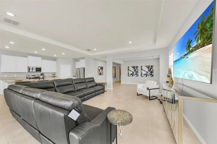 The flow between the dining and living rooms strikes a perfect balance, providing an ideal amount of space that feels neither too expansive nor too confined.