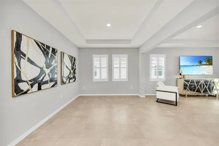 Tray ceiling in the dining room adds an extra wow factor, elevating the space with elegance and charm.