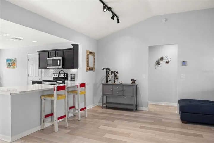 MULTI FUNCTION ROOM/DINING ROOM WITH STUNNING VINYL PLANK FLOORING