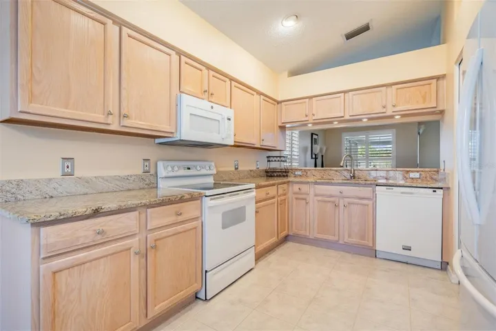 Stone countertops with more than ample counter and cabinet space