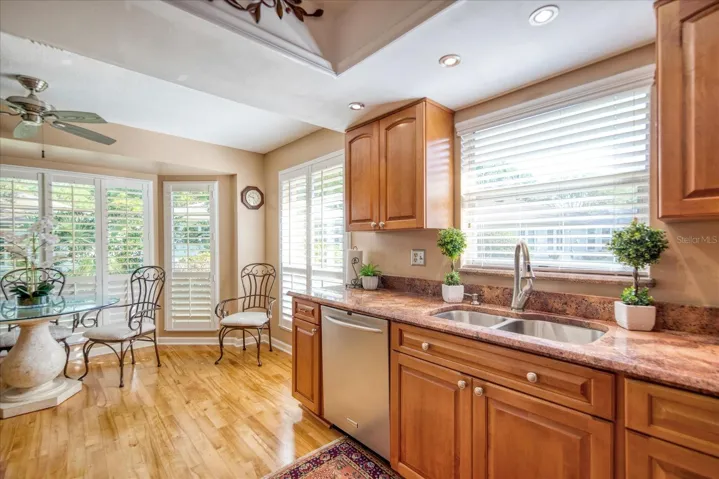 Upgraded cabinets & lighting with raised tray ceiling & granite counters~