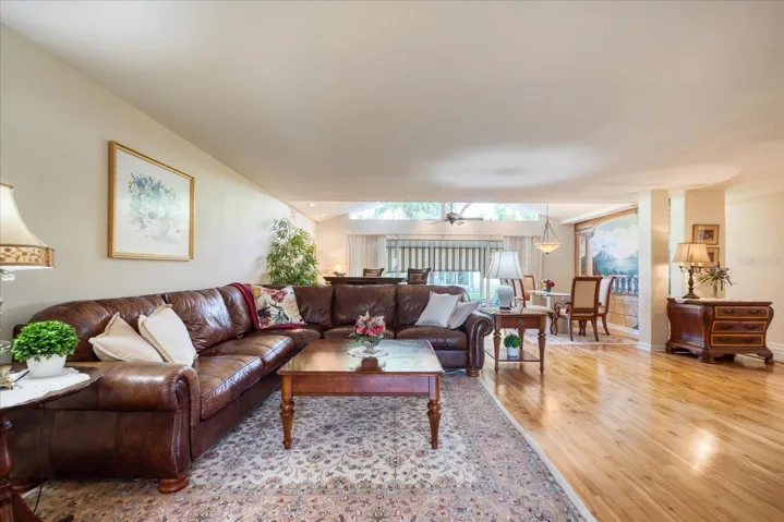 Open living & dining areas with engineered wood flooring~