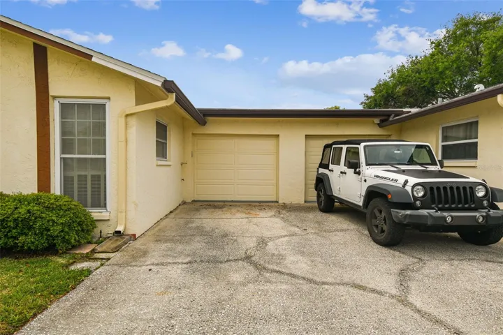 garage on left and dedicated parking space