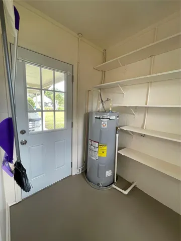 Inside Utility with exterior door to carport