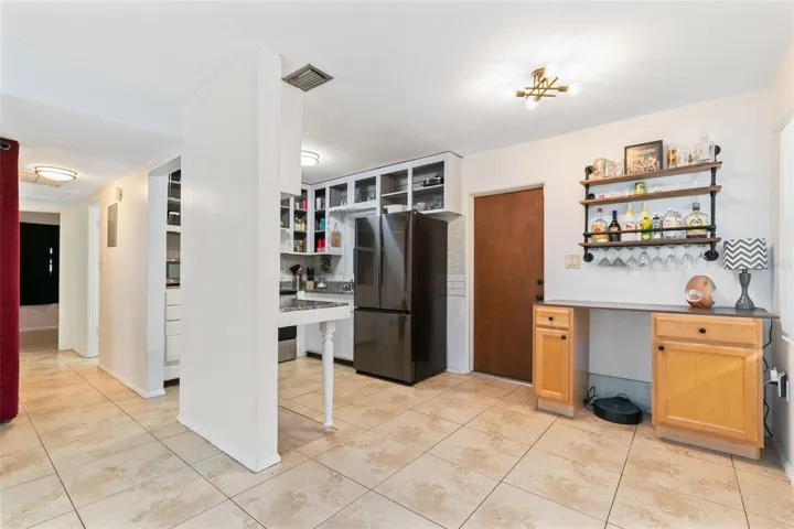 Ceramic tile floors throughout make for easy cleaning.