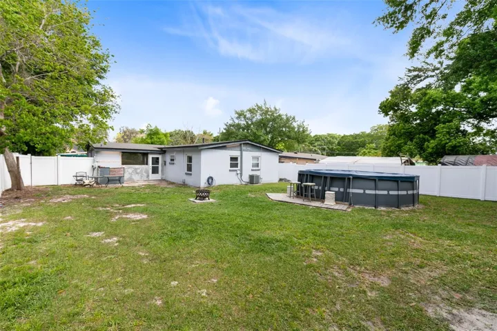Venture into the huge, fenced backyard, complete with an above-ground pool for endless enjoyment.