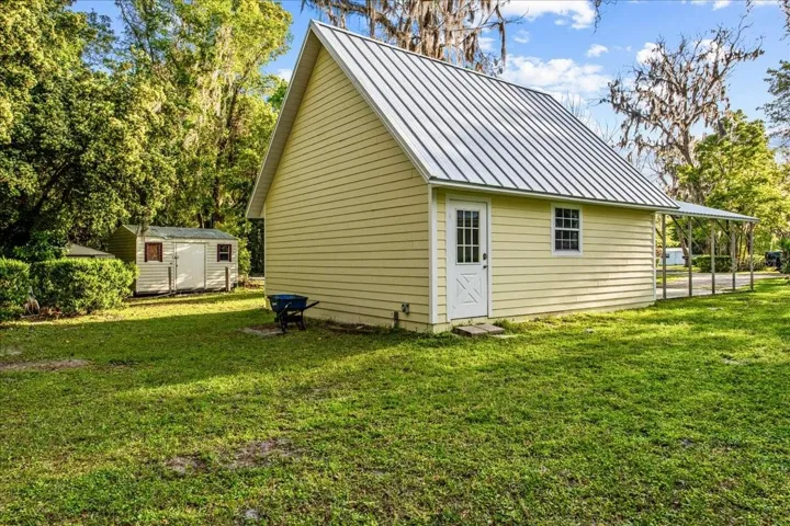 SW view of stand alone garage. This garage has an attic that could be another room of some sort. Perhaps another bedroom, man cave etc. It only has power, no water.