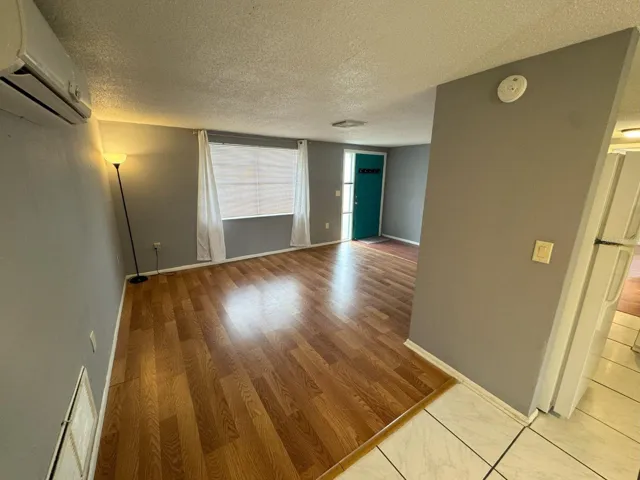 Dining area leading into kitchen