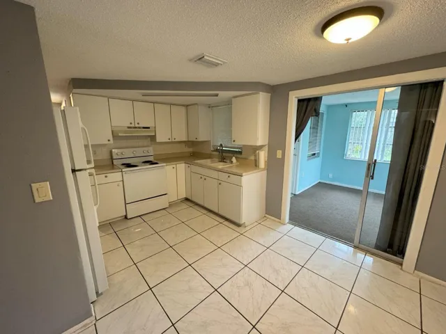 Kitchen with entrance to bonus room