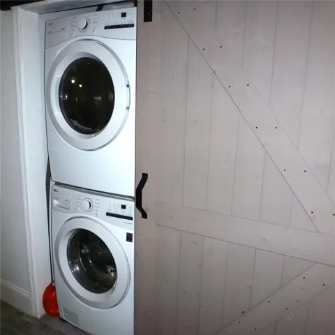The washer and dryer are hidden behind a custom 