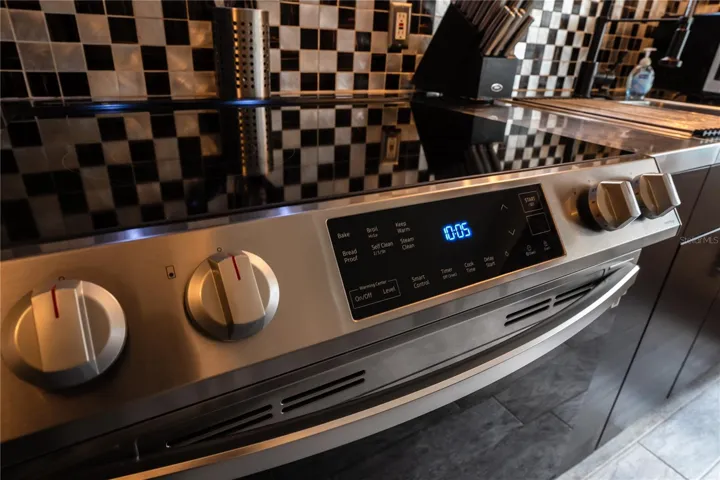 All new appliances, highlighted by the custom backsplash
