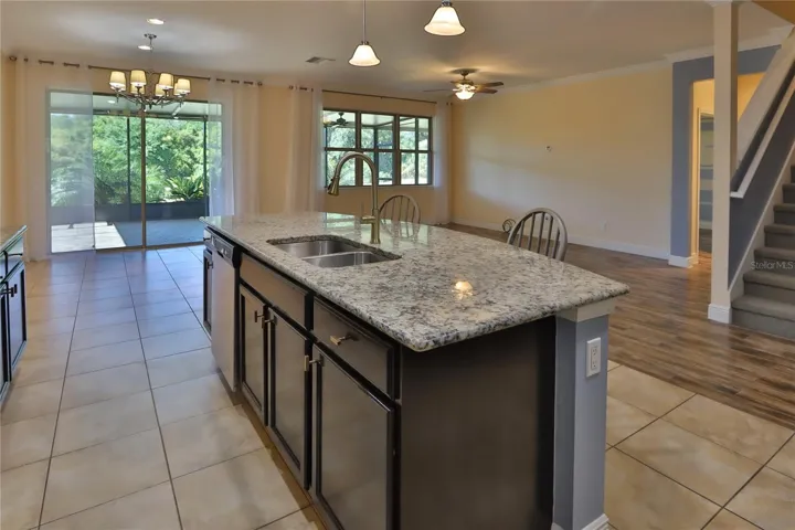 Flows to a huge outdoor patio with caged lanai.
