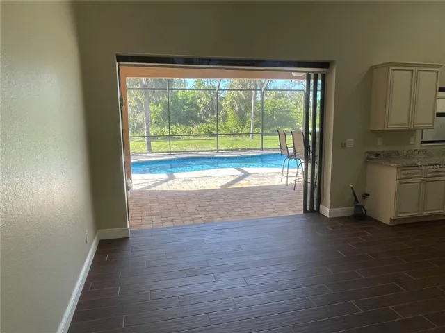GREAT ROOM POCKET DOORS POOL VIEW