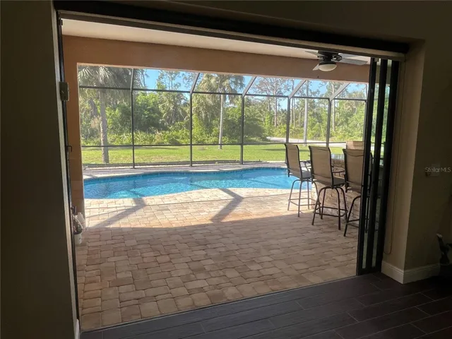 POCKET DOORS VIEW FROM KITCHEN GREAT ROOM