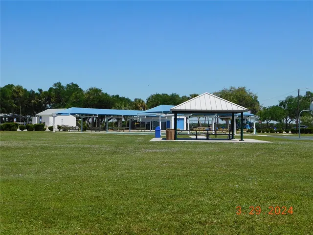 Covered picnic tables and shuffleboard courts.