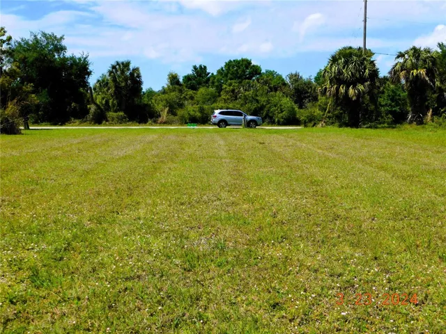 This is a deep, oversized, waterfront lot. The auto is parked on the street for perspective.