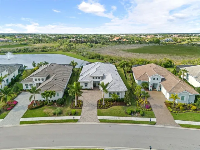 Aerial view of exterior with pond and preserve views