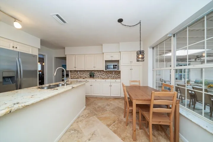 Eating area in kitchen overlooking the pool!