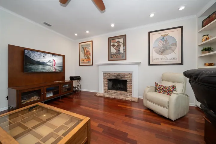 Office/living room with wood burning fireplace!