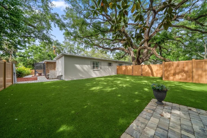 Fenced in back yard with turf!