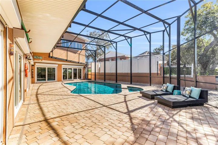 Dreamlike pool area. Salt water, solar heated pool and spa. Screened in .