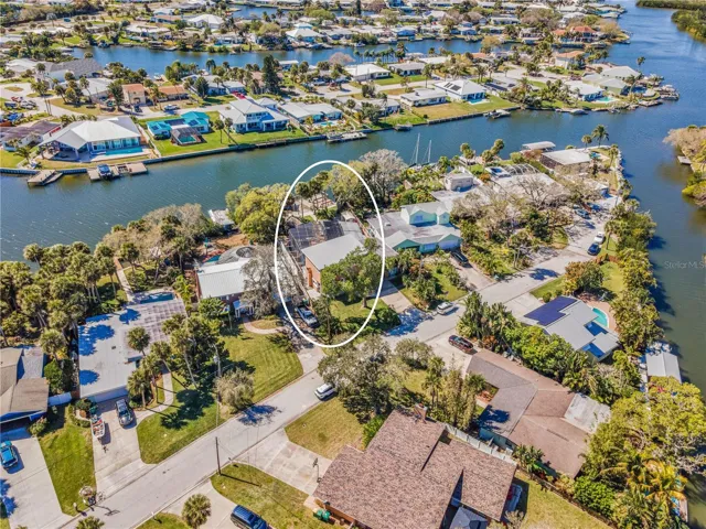 Waterfront home with a pool and sort canal to the Banana River