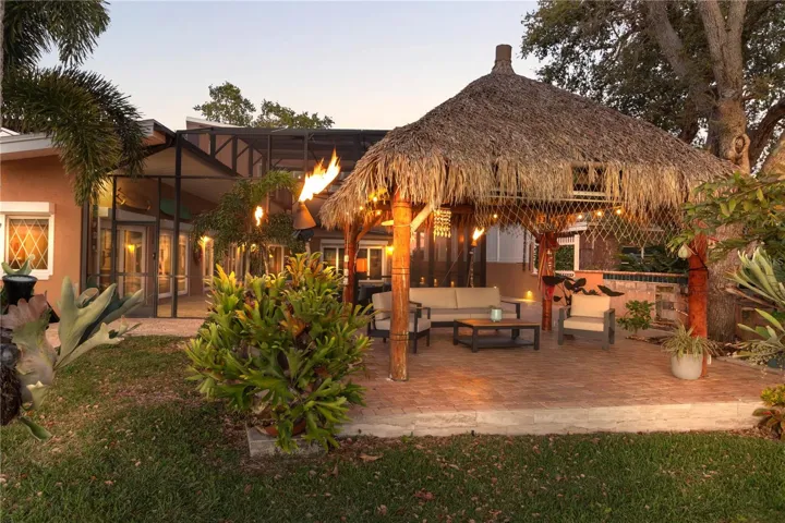 Gazebo with gas lit torches aroundit