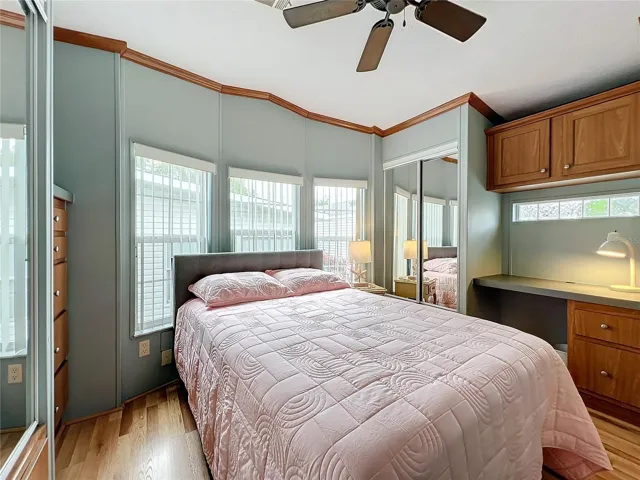 The bedroom offers plenty of closet and storage space and has a built-in desk