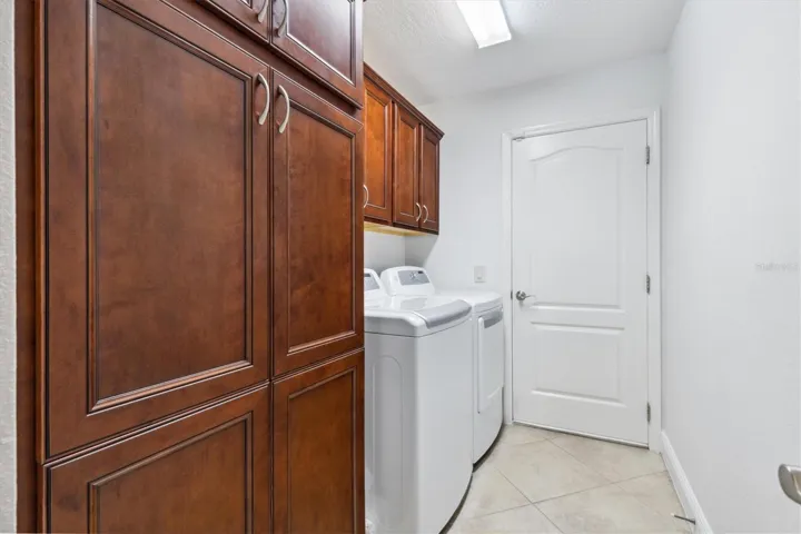 LAUNDRY ROOM WITH LARGE BUILT IN PANTRY