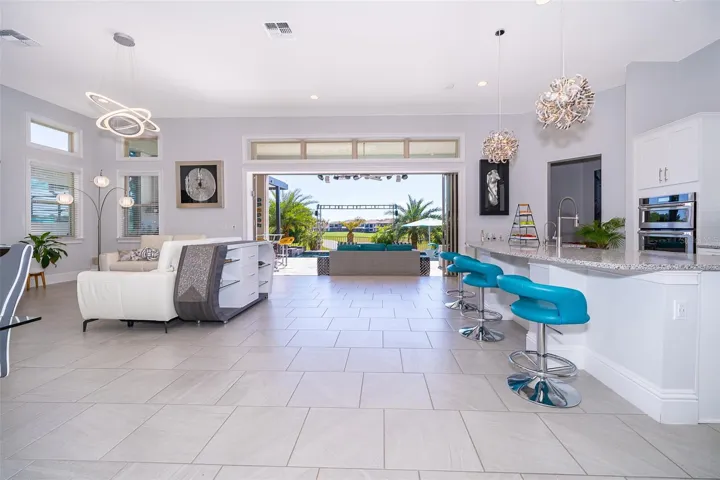 4 sliding doors open completely to the side that gives a complete view to the Golf Course and Water Pond