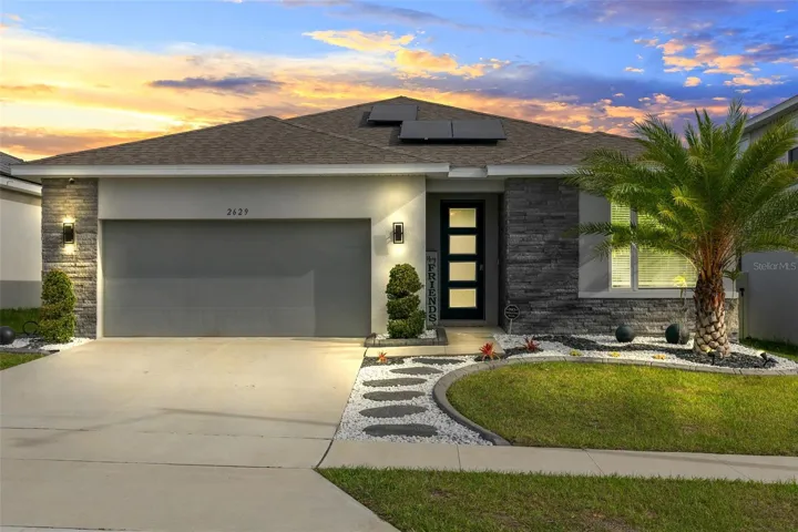 As you arrive at this beautiful home, you'll be greeted by meticulously crafted landscaping that enhances the curb appeal and sets the tone for the modern and inviting interior.