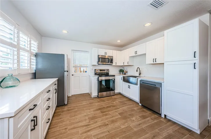 The updated kitchen opens to the great room.