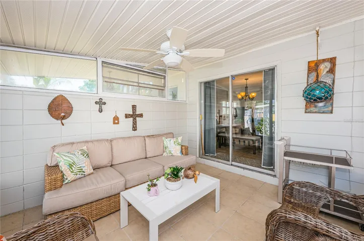 Screened Side Porch is perfect for an afternoon tea or a good book.