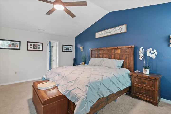 Primary Bedroom with vaulted Ceiling & Paddle Fan