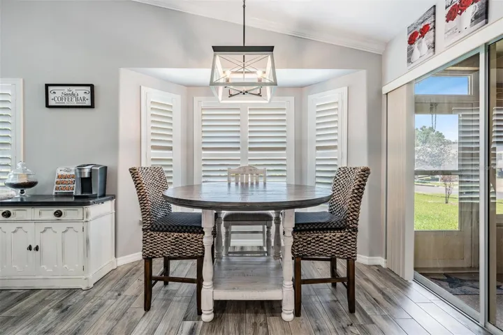 Another designer light fixture hangs over the breakfast nook
