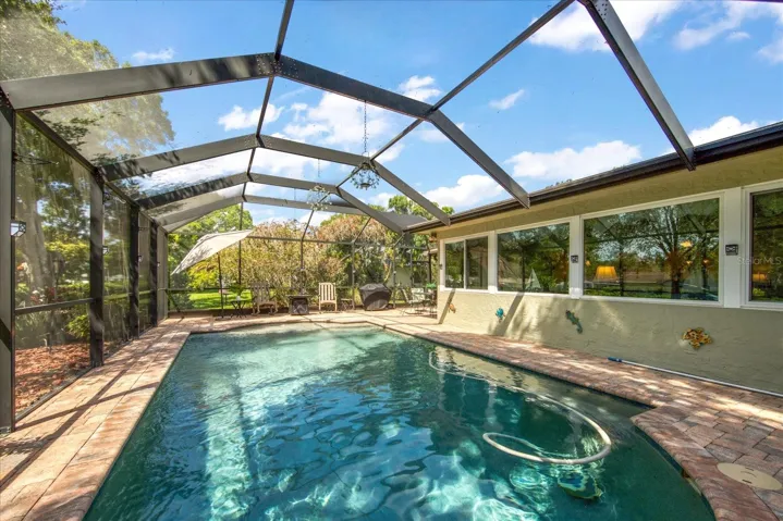 Self cleaning solar heated salt water pool with sturdy screened cage~