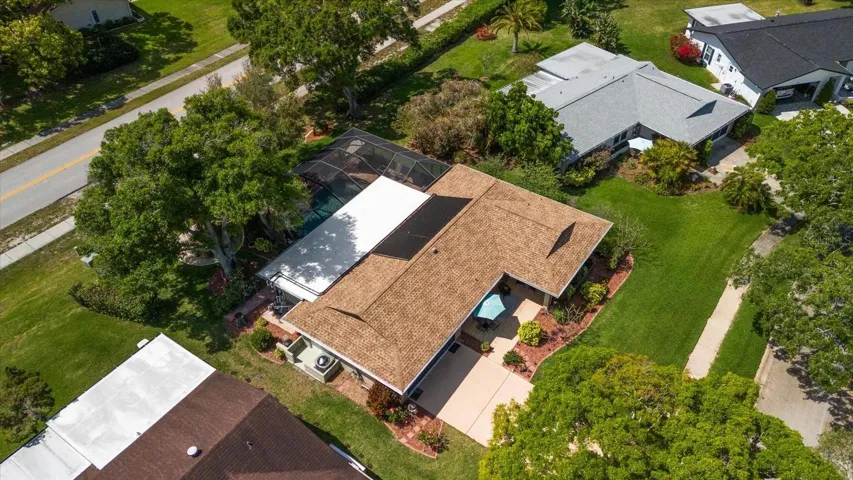 Note the new roof, mature rear privacy landscaping & defined planting beds~