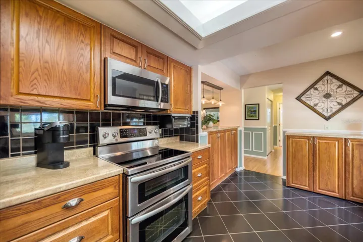 More open kitchen with upgraded appliances & additional storage~