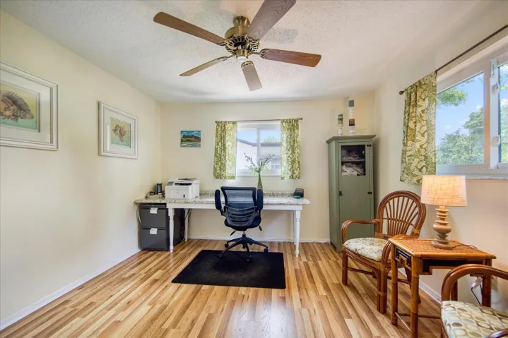 Bedroom 3 with hurricane rated windows and a built-in closet in use as office~