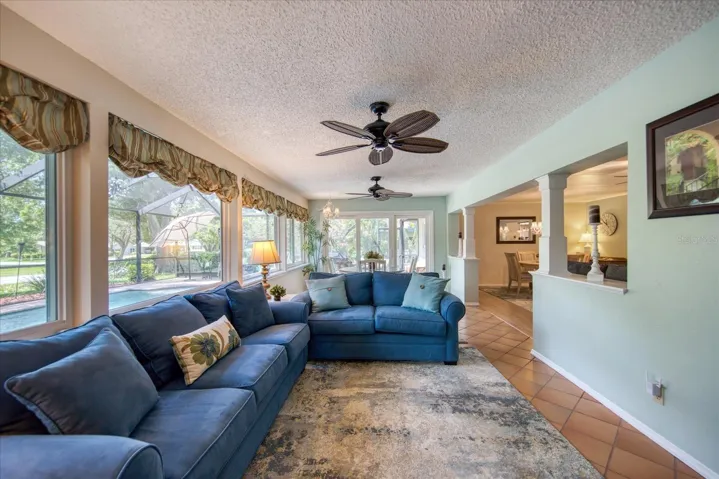 Newer hurricane rated windows & triple sliding doors safely enhance light & open up the pretty view~