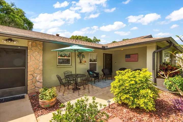 North-facing front porch with pristine landscaping~