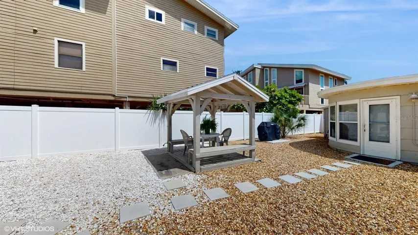 Path Between 2 Homes w/ Seating Area and Grill