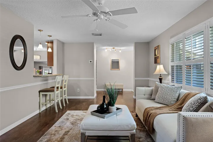 Living Room with Breakfast Bar pass through to Kitchen