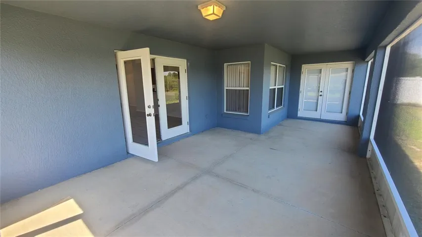 LARGE SCREENED PORCH UNDER ROOF