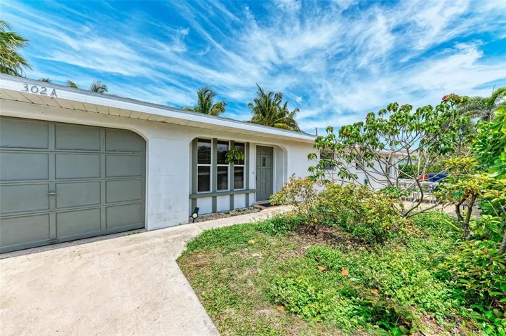 Front of duplex facing the 1 car garage