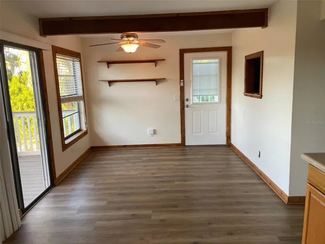 Large dining room with slider out to balcony