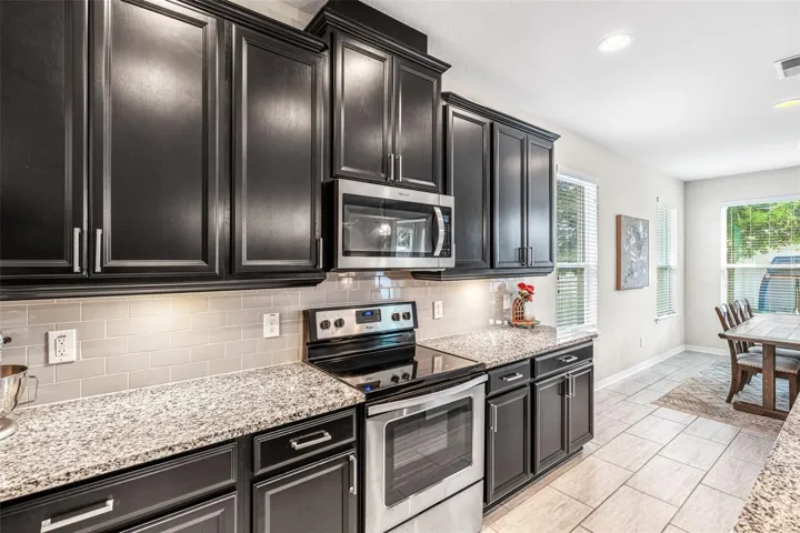 Stone countertops with stainless steel appliances
