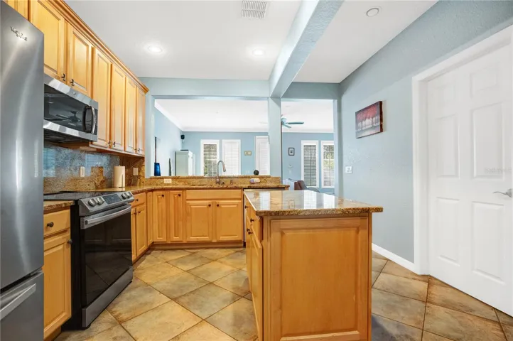 Kitchen With Door Entrance to Laundry Room and Bathroom