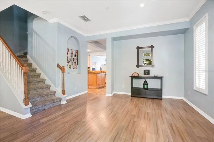 Front Entrance View to Dining Room and Upstairs Staircase